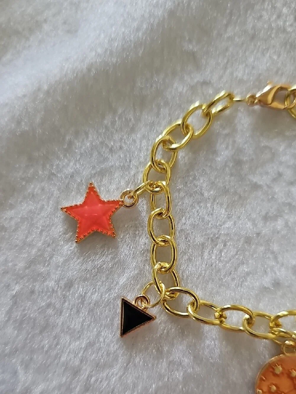 Gold Space Themed Charm Bracelet with Orange and Black Accents